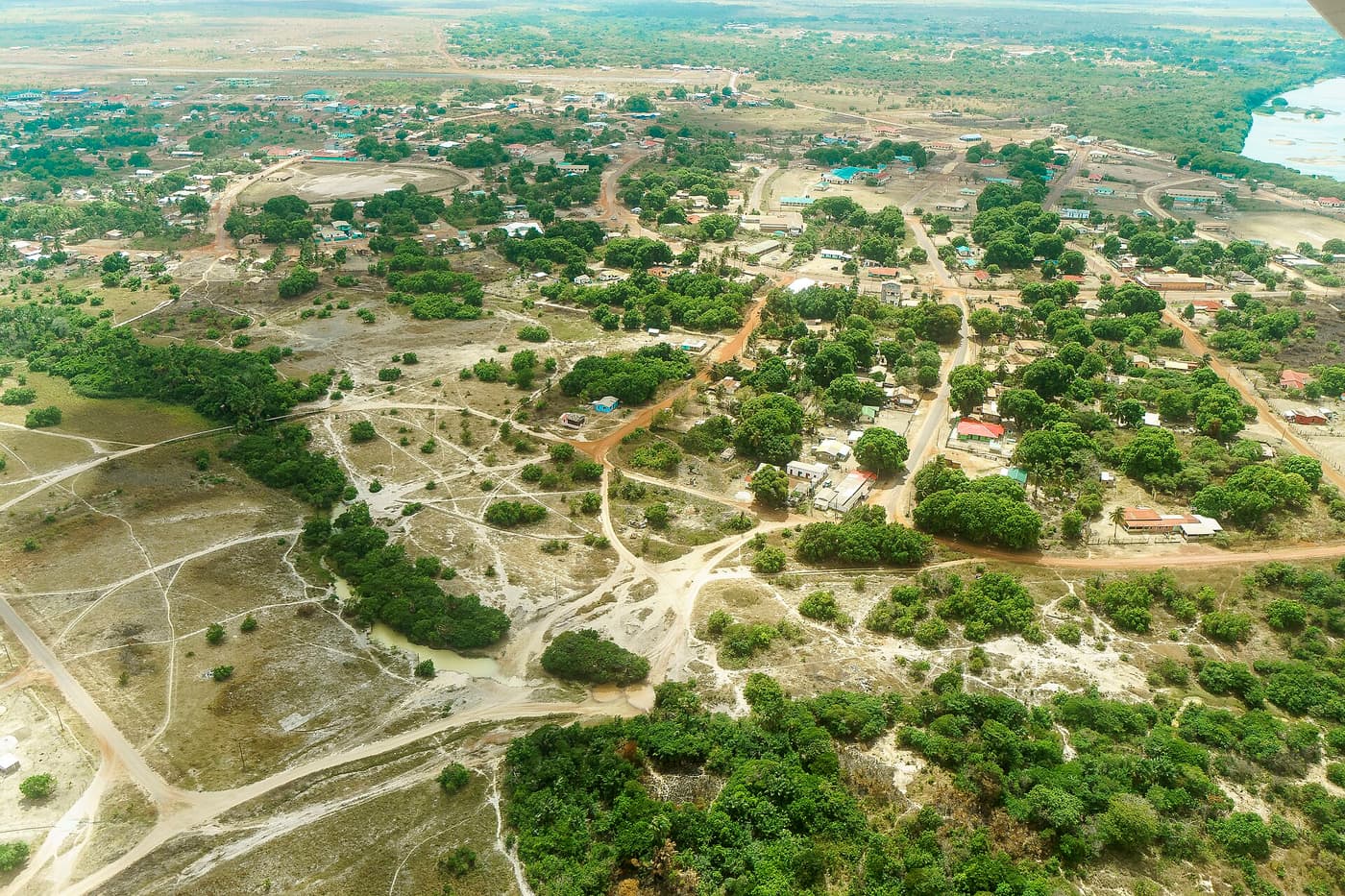 An aerial view of Lethem’s scattered buildings and red-earth roads on the savannah